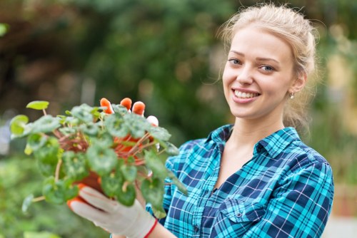 Gardener discussing a complaint with a customer in a garden